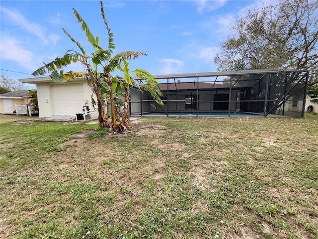 view of yard with glass enclosure and an outdoor pool