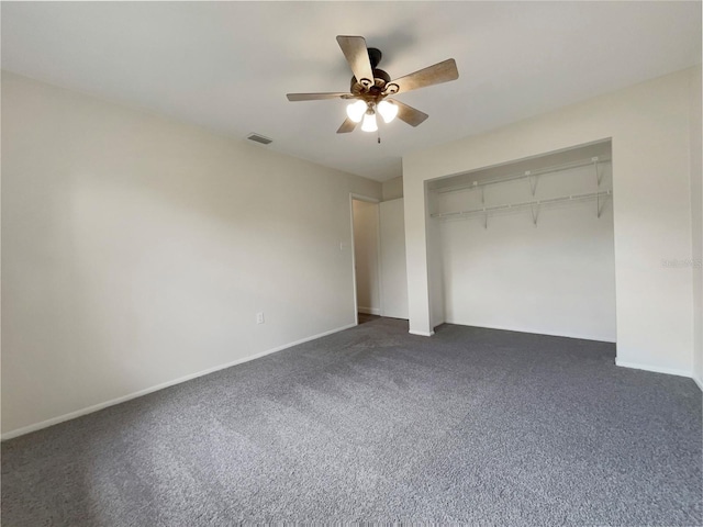 unfurnished bedroom featuring ceiling fan, a closet, dark carpet, and baseboards