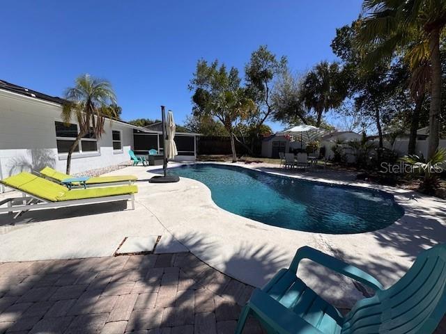 pool featuring a patio area