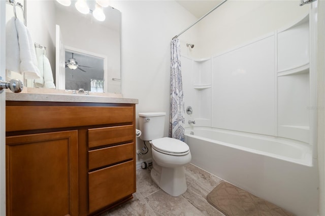 bathroom featuring vanity, shower / bath combo with shower curtain, and toilet