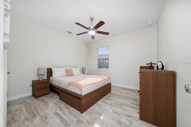 bedroom with a ceiling fan, visible vents, and baseboards