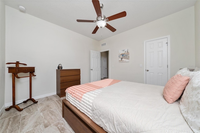 bedroom with a ceiling fan, visible vents, and baseboards