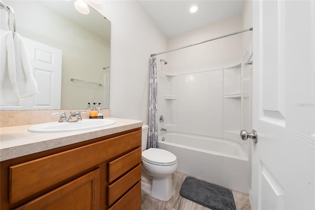 full bathroom with shower / tub combo with curtain, vanity, and toilet