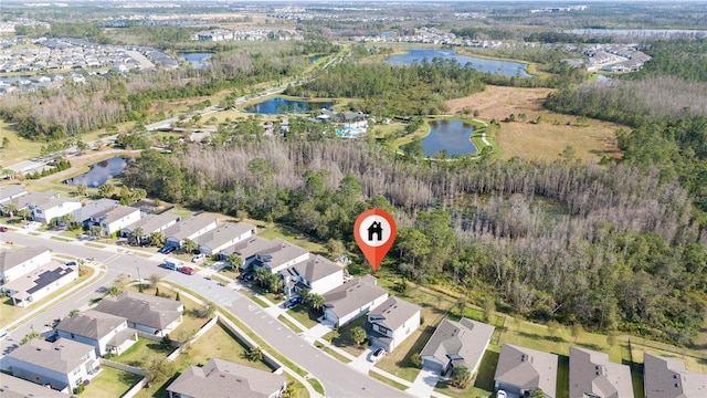 aerial view featuring a water view and a residential view