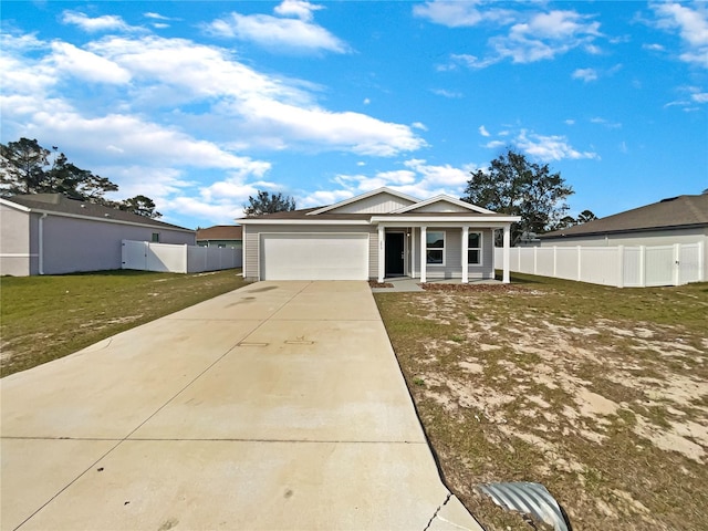 ranch-style house with driveway, a garage, fence, and a front yard