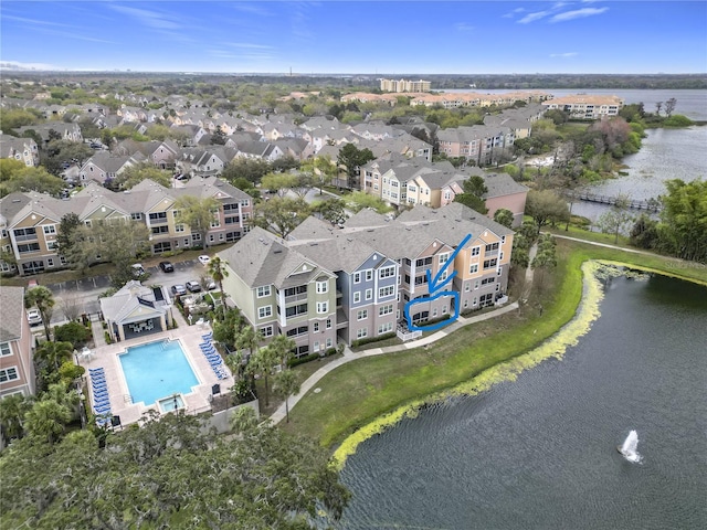 drone / aerial view with a residential view and a water view