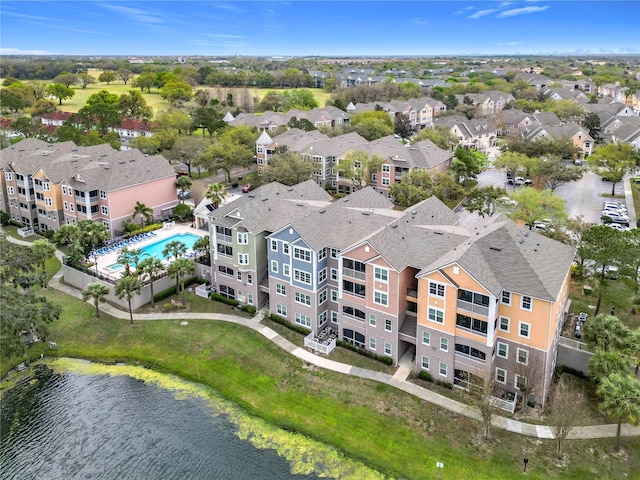 bird's eye view featuring a water view and a residential view