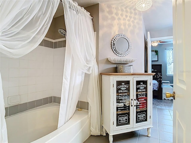 bathroom featuring a ceiling fan, tile patterned flooring, and shower / bath combo with shower curtain