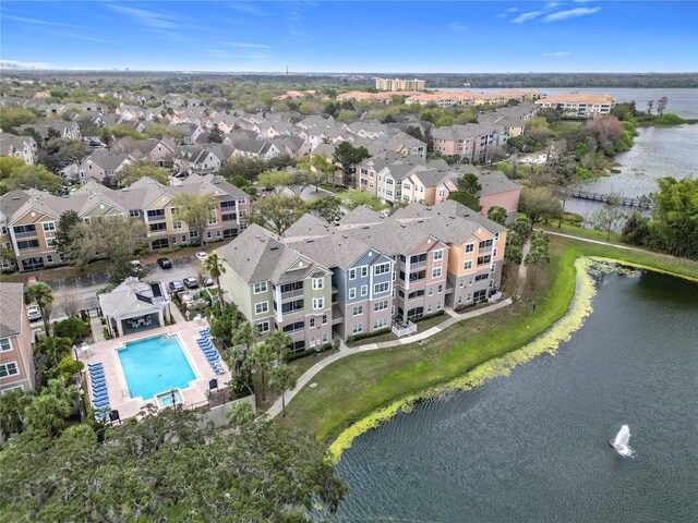 birds eye view of property with a residential view and a water view