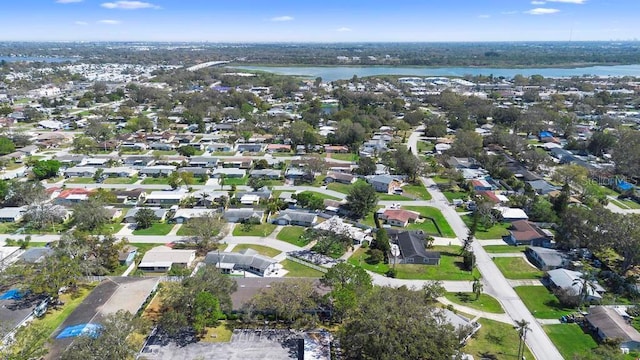 birds eye view of property featuring a water view and a residential view