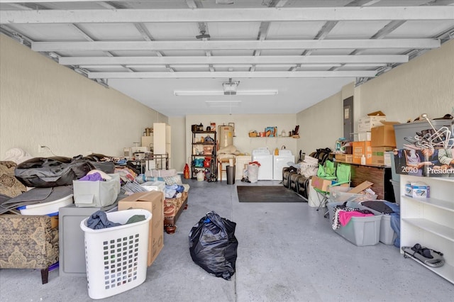 garage featuring a garage door opener and washing machine and clothes dryer