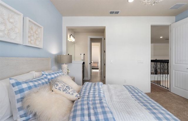 carpeted bedroom with visible vents