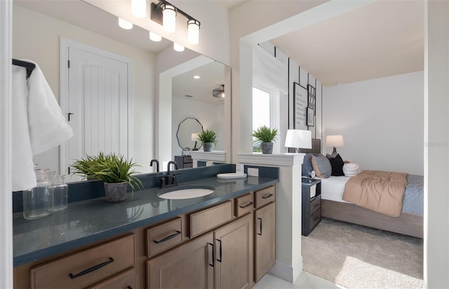 ensuite bathroom featuring ensuite bathroom and vanity