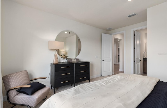 bedroom featuring visible vents and baseboards