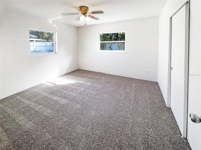 unfurnished bedroom featuring carpet and a ceiling fan