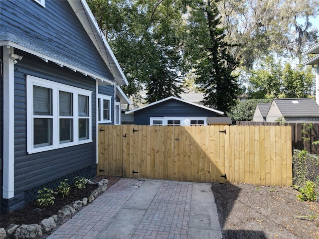 exterior space featuring fence and a gate