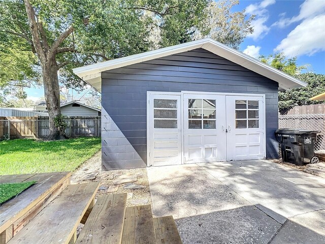 view of shed with fence