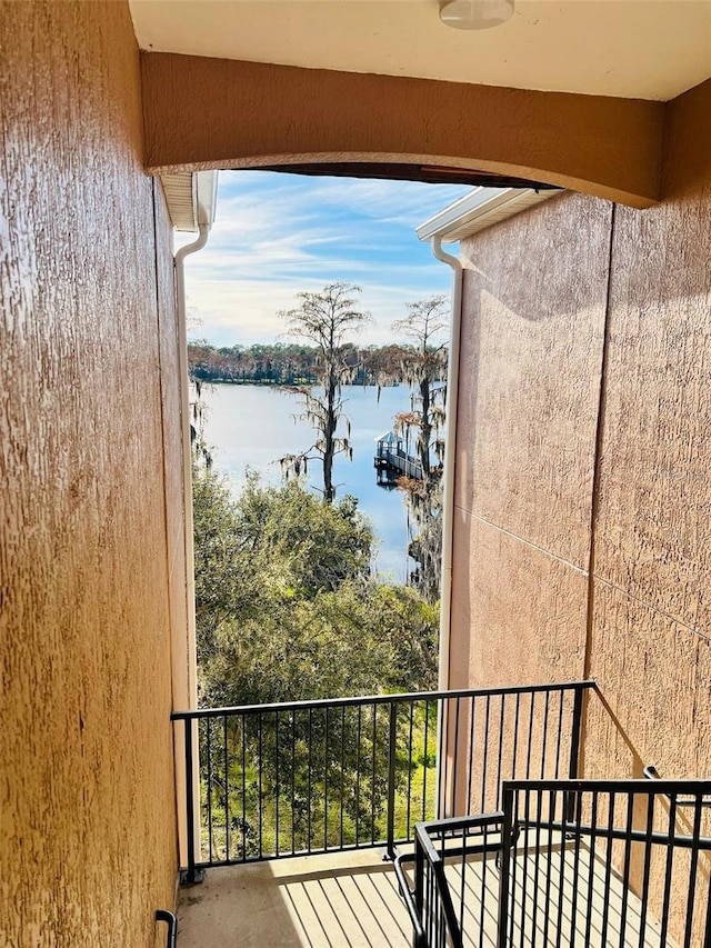 balcony featuring a water view