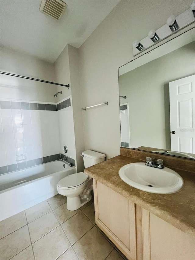 full bathroom with shower / bath combination, visible vents, toilet, vanity, and tile patterned flooring