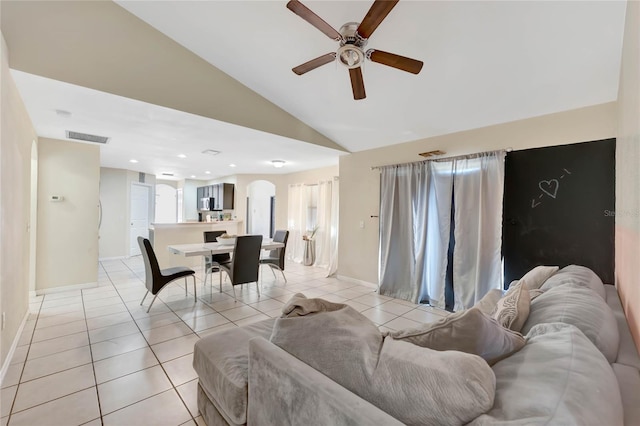 68 Herring Ct, Kissimmee, FL 34759 - living area with baseboards, visible vents, lofted ceiling, light tile patterned flooring, and ceiling fan