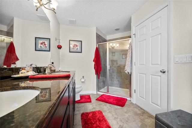 full bathroom with toilet, a sink, visible vents, a shower stall, and double vanity