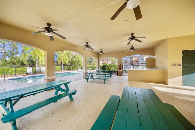 view of patio / terrace with fence and a fenced in pool