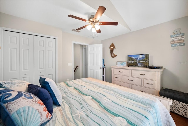 bedroom with ceiling fan, visible vents, and a closet