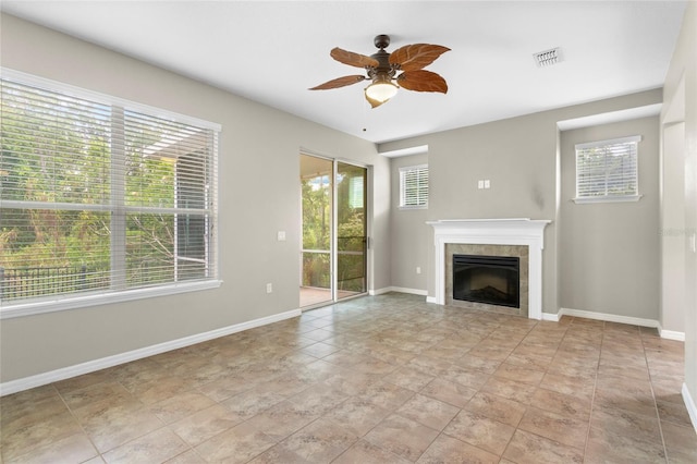 2015 Shalimar Loop, Sanford, FL 32773 - unfurnished living room with a tiled fireplace, ceiling fan, and baseboards