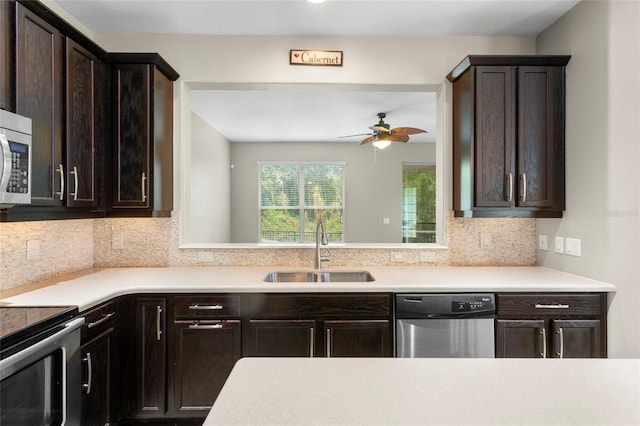 2015 Shalimar Loop, Sanford, FL 32773 - kitchen featuring appliances with stainless steel finishes, a sink, dark brown cabinetry, light countertops, and ceiling fan