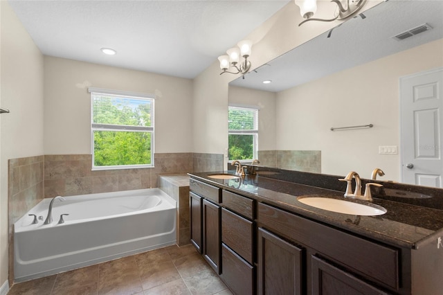 2015 Shalimar Loop, Sanford, FL 32773 - bathroom with a bath, double vanity, and a chandelier