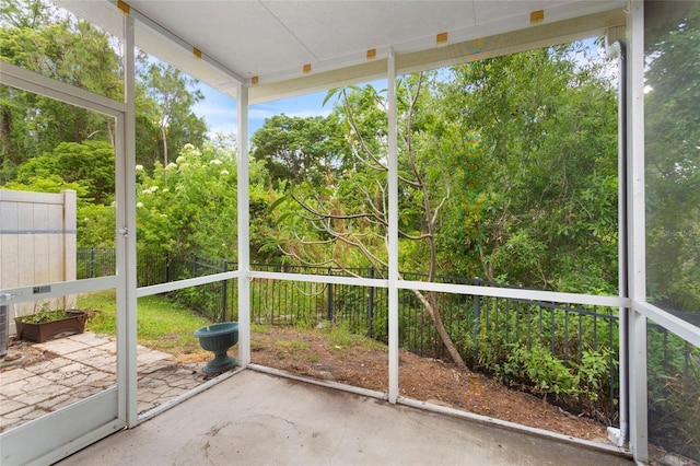 2015 Shalimar Loop, Sanford, FL 32773 - unfurnished sunroom with view of scattered trees