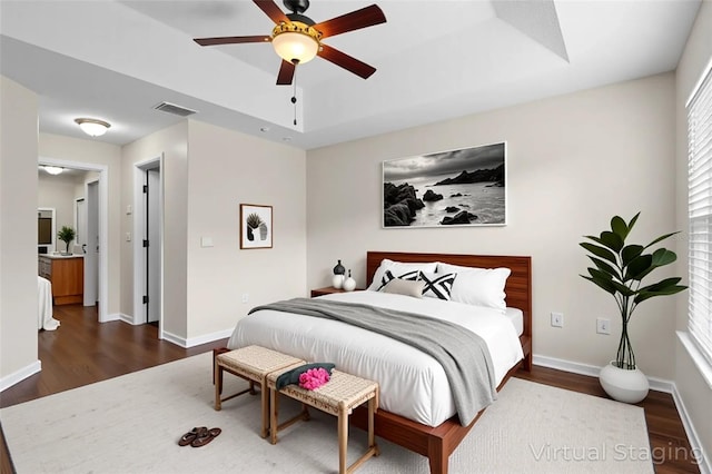 2015 Shalimar Loop, Sanford, FL 32773 - bedroom with dark wood-type flooring, a raised ceiling, and multiple windows