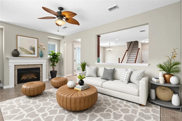 2015 Shalimar Loop, Sanford, FL 32773 - living room with ceiling fan, a tile fireplace, and a chandelier
