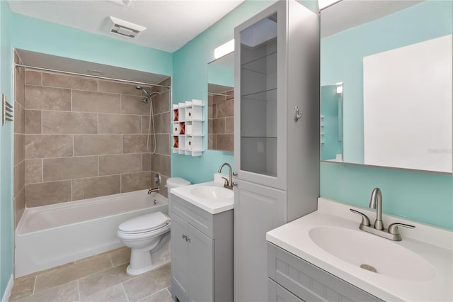 full bathroom with visible vents, toilet, shower / bathtub combination, tile patterned flooring, and vanity