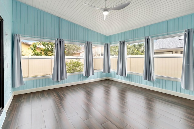 unfurnished sunroom featuring vaulted ceiling and a ceiling fan