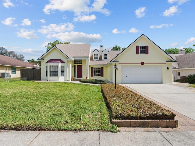 view of front of house featuring a garage, central AC, fence, concrete driveway, and a front yard