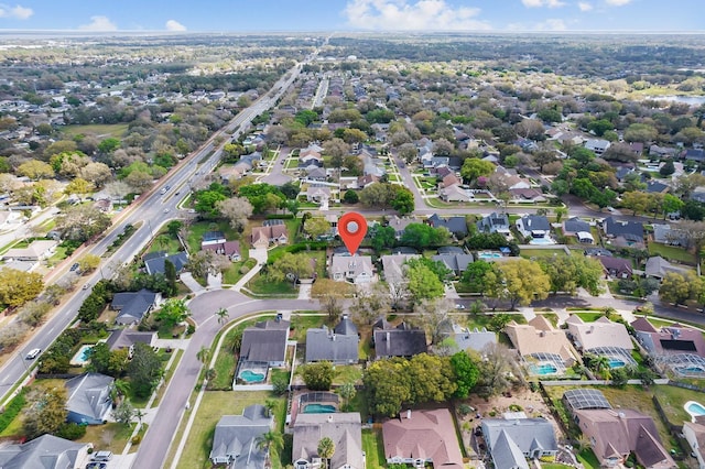 birds eye view of property with a residential view