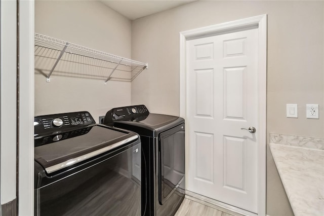 laundry area with laundry area and washer and dryer