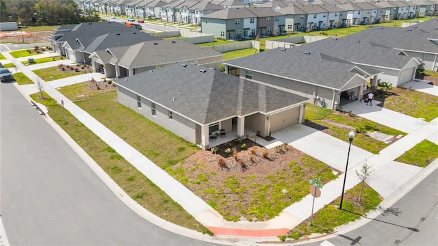 birds eye view of property with a residential view