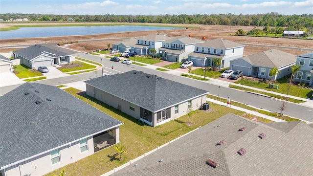 aerial view with a water view and a residential view