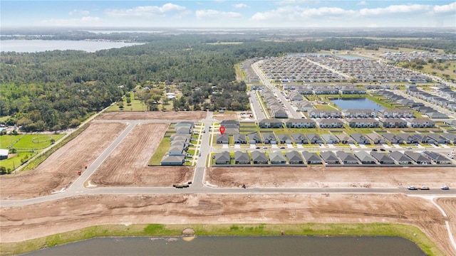 drone / aerial view featuring a water view and a residential view