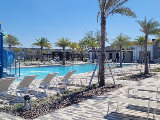 pool featuring a patio area and fence