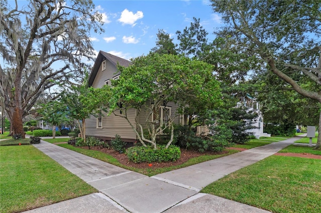 view of side of property featuring a yard