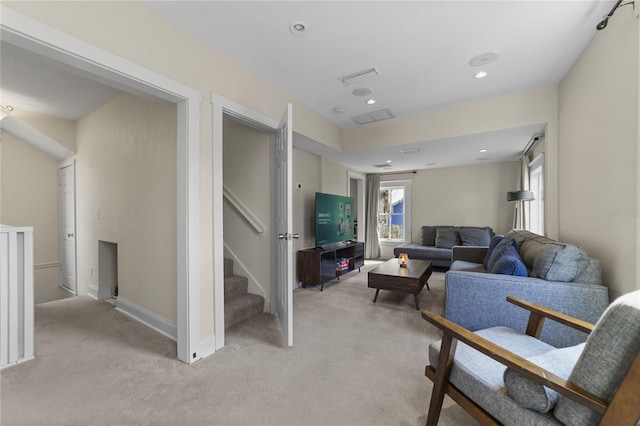 living area featuring recessed lighting, stairway, baseboards, and light colored carpet