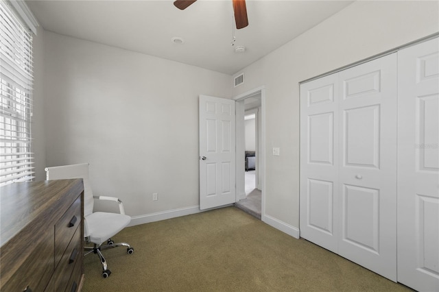 interior space with a ceiling fan, carpet, visible vents, and baseboards