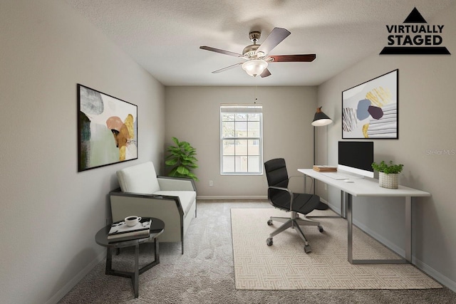 office area featuring baseboards, carpet, a ceiling fan, and a textured ceiling