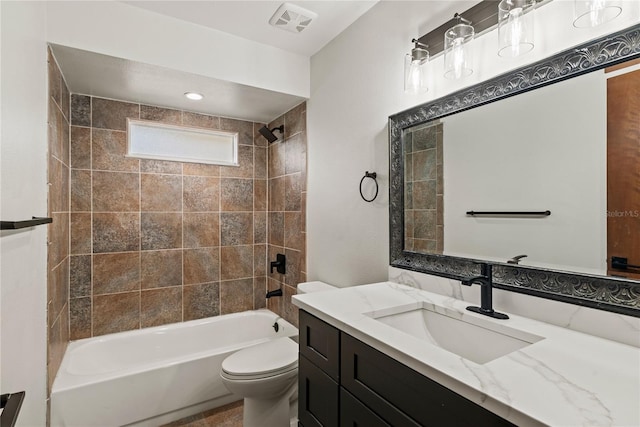 bathroom with toilet, tub / shower combination, vanity, and visible vents