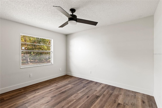 spare room featuring a ceiling fan, a textured ceiling, baseboards, and wood finished floors