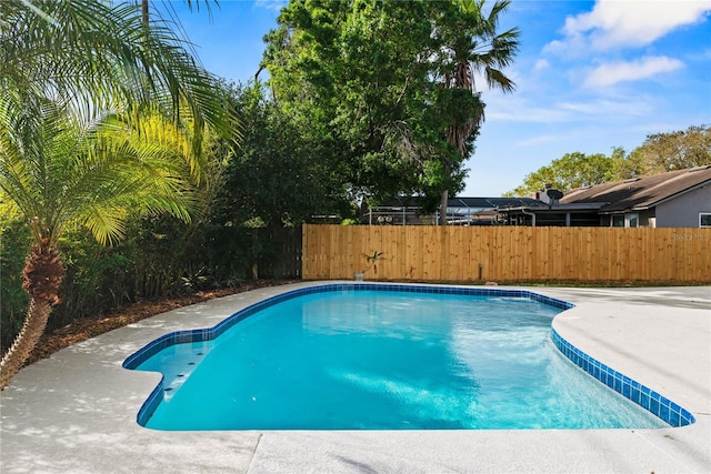 view of swimming pool with fence and a fenced in pool