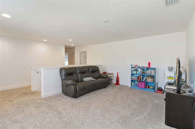 interior space with recessed lighting, visible vents, baseboards, and light colored carpet